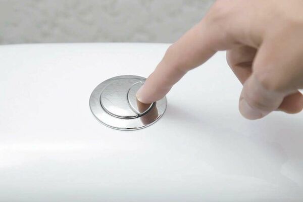 Illustration schématique des deux boutons de chasse d'eau et de leur fonction